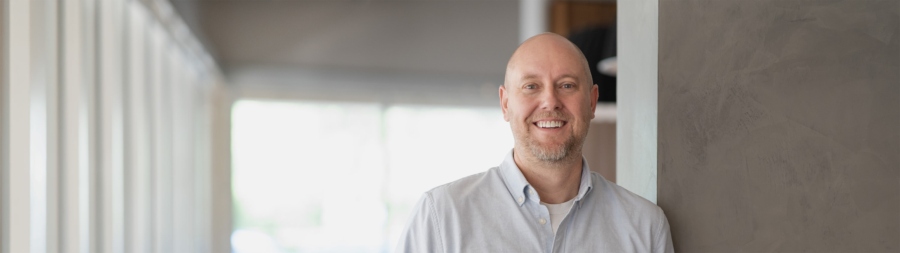 A man smiling and ready to help you with your website needs.