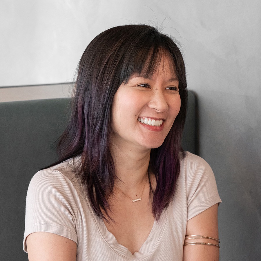 A woman smiling.