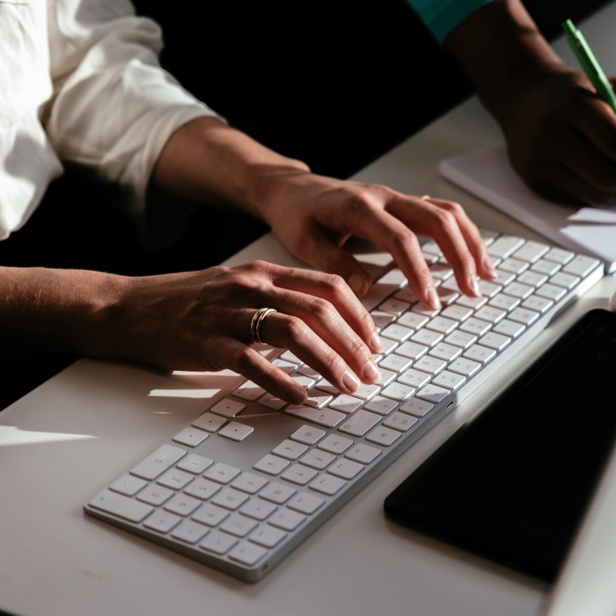 Person's hands working on laptop