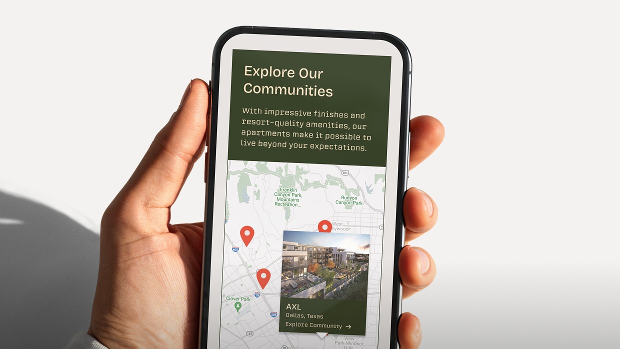 A hand holding a phone showing Jonah's Multifolio product